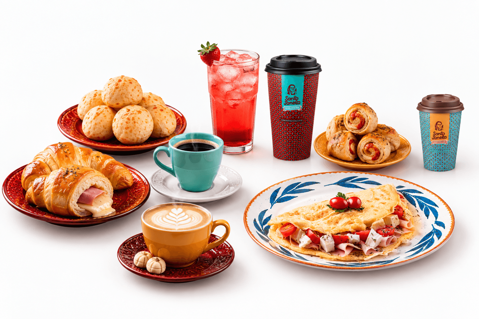 Mesa posta da Santa Janela: café preto, cappuccino, dois copos de viagem com a marca, suco gelado, pães de queijo, croissants de presunto e queijo, enroladinhos e uma omelete.